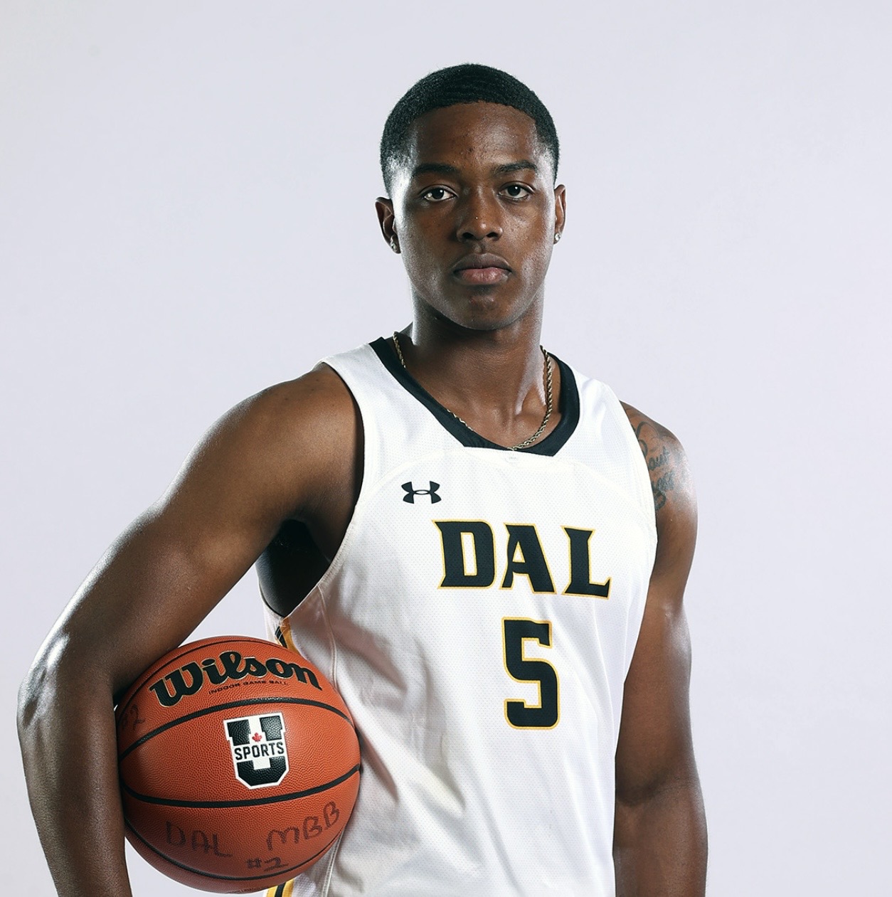 Rashawn in his Dalhousie basketball jersey